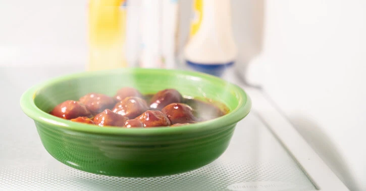 Bowl of hot foot in a refrigerator