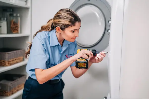 Mr. Appliance professional working on front load dryer