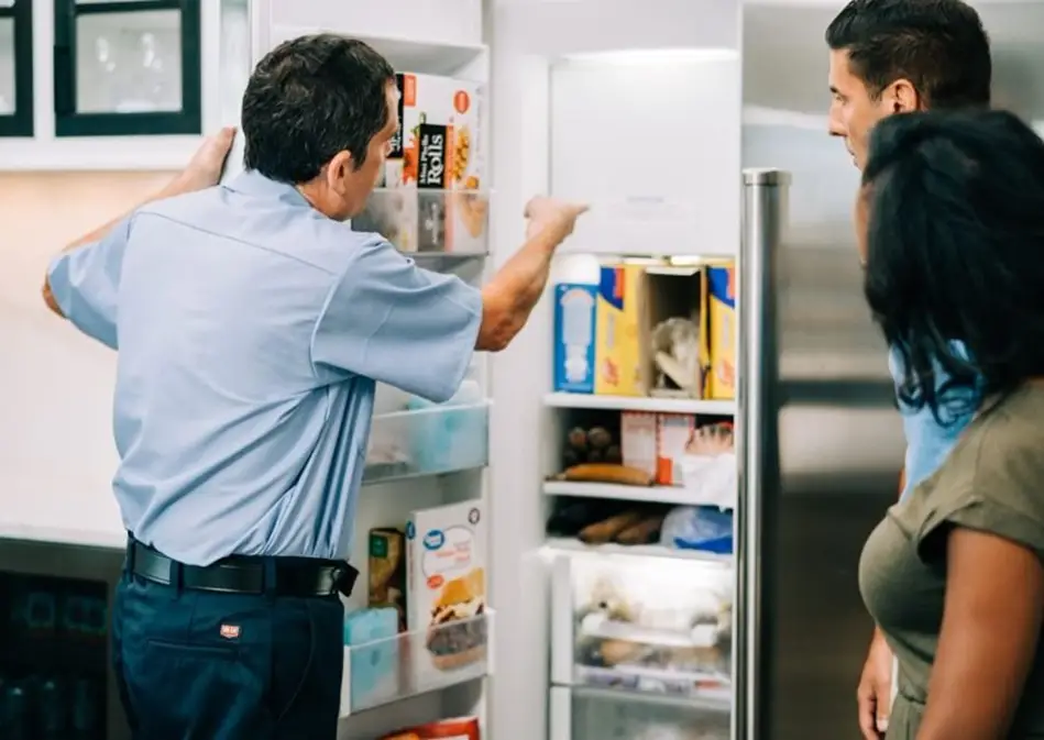 Mr. Appliance tech discussing freezer repairs