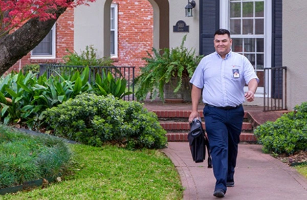 Mr Appliance repairman leaving a home.