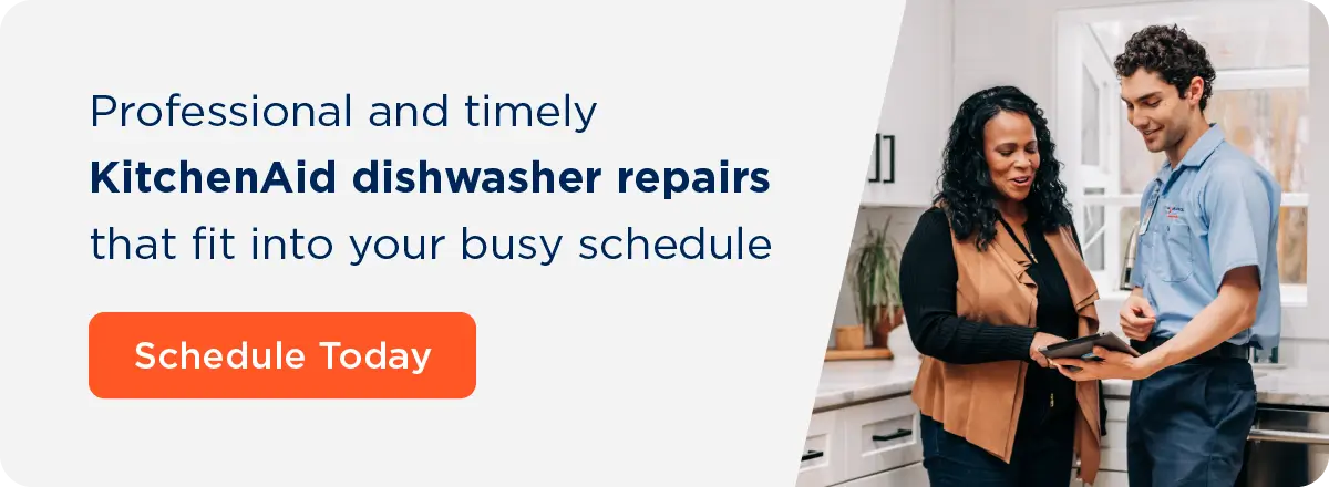 Professional and timely KitchenAid dishwasher repairs that fit into your busy schedule. This text is next to an image of a Mr. Appliance service professional reviewing a tablet with a customer. Schedule KitchenAid dishwasher repair with Mr. Appliance.